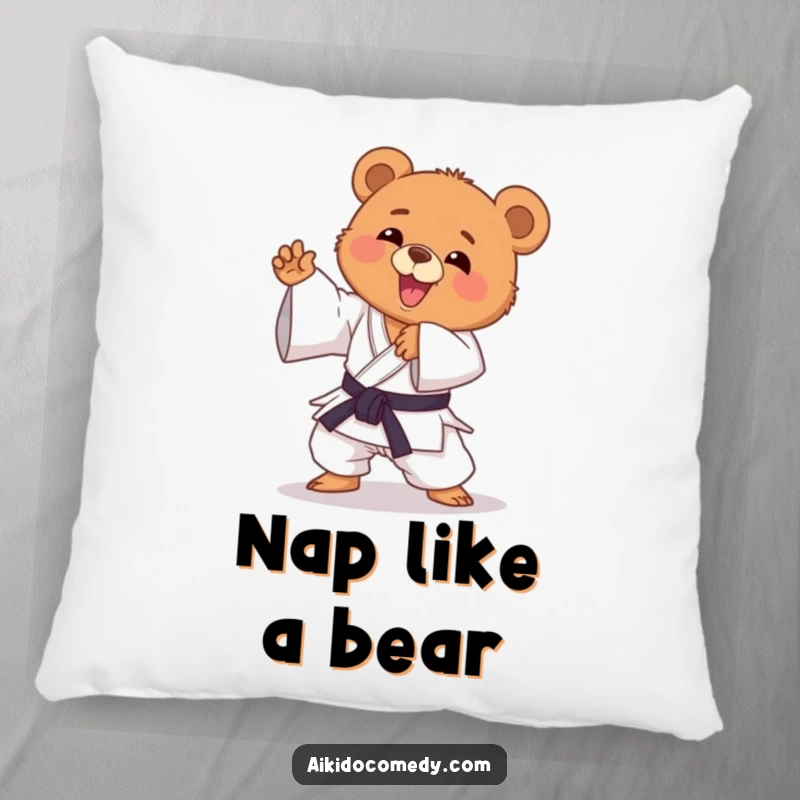 Funny bear cub in gi performing an Aikido move on a soft pillow. A cute and funny gift.
