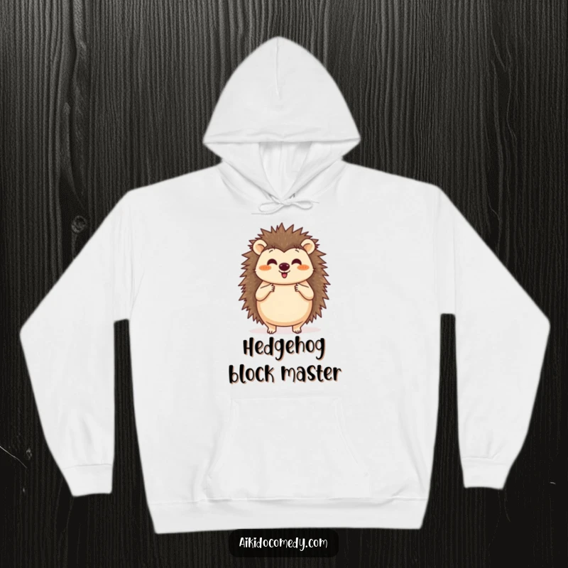 Funny hoodie showing a happy hedgehog practicing a circular blocking motion with its paws, ideal for staying warm.