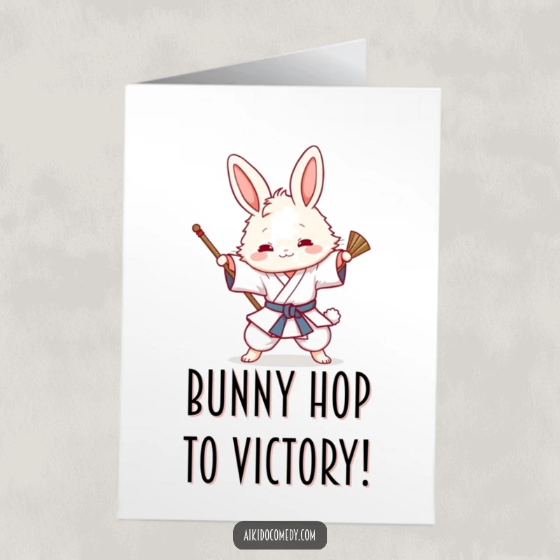 Funny Free Printable Congrats Card of a fluffy bunny in a gi humorously attempting an Aikido sweeping technique, celebrating a win.